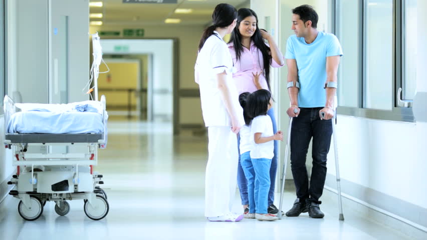 Case manager consulting with family of an injured workers compensation patient.