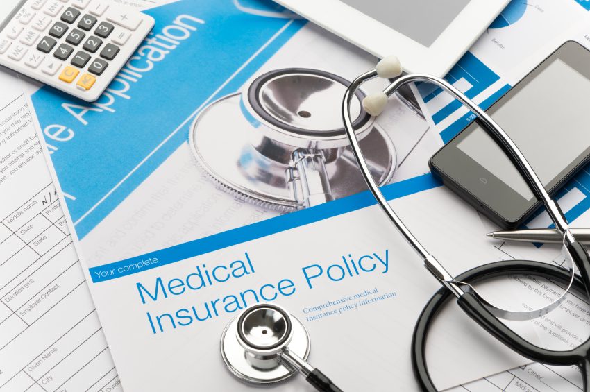 Image of stethoscope and medical insurance policy